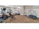 Finished basement gym with mirrored wall and multiple pieces of fitness equipment at 5475 Copper Creek Pass, Cumming, GA 30040