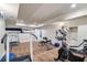 A well-lit home gym featuring modern exercise equipment and plenty of space for a complete workout at 5475 Copper Creek Pass, Cumming, GA 30040