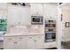 Custom kitchen featuring modern stainless steel appliances and white cabinets at 5475 Copper Creek Pass, Cumming, GA 30040