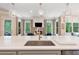 Kitchen island with sink and views to the backyard and fireplace at 5475 Copper Creek Pass, Cumming, GA 30040