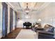 Inviting living room with coffered ceiling, large windows, comfortable seating, and ample natural light at 5475 Copper Creek Pass, Cumming, GA 30040