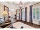 Cozy living room with neutral walls, chair and lots of natural light at 5475 Copper Creek Pass, Cumming, GA 30040