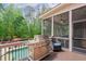 Outdoor stainless steel gas grill with a side burner and covered area by the outdoor swimming pool at 5475 Copper Creek Pass, Cumming, GA 30040