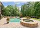 Gorgeous gunite pool and stone spa overlooking a mature landscaped private backyard at 5475 Copper Creek Pass, Cumming, GA 30040