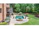 Beautiful backyard with pool, spa, outdoor dining, lounge chairs, and well-manicured landscaping at 5475 Copper Creek Pass, Cumming, GA 30040