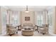 Cozy sitting area in main bedroom with plush seating and large windows at 5475 Copper Creek Pass, Cumming, GA 30040