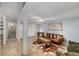 Basement living area with comfortable seating, adjacent to an office and entry to the stairwell at 203 Concorde Sw Way, Lilburn, GA 30047