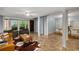Finished basement with living area, office space, and ample natural light through sliding glass doors at 203 Concorde Sw Way, Lilburn, GA 30047