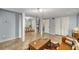 Large basement area with defined spaces for relaxing and working, enhanced by neutral tile flooring at 203 Concorde Sw Way, Lilburn, GA 30047