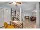 Spacious basement featuring a home office and cozy seating area with bright light fixtures at 203 Concorde Sw Way, Lilburn, GA 30047