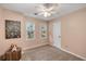 Cozy bedroom with natural light, complemented by neutral walls and soft carpeting at 203 Concorde Sw Way, Lilburn, GA 30047