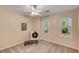 Comfortable bedroom with natural lighting, soft carpet, and a peaceful view of the outside at 203 Concorde Sw Way, Lilburn, GA 30047