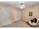 Bright, carpeted bedroom with ample closet space, neutral walls, and natural light at 203 Concorde Sw Way, Lilburn, GA 30047