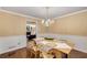 Well-lit dining room featuring stylish decor and seamless transition to living area at 203 Concorde Sw Way, Lilburn, GA 30047
