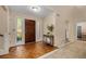 Inviting foyer with hardwood flooring, sidelight windows and staircase to the second floor of the home at 203 Concorde Sw Way, Lilburn, GA 30047