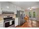 Bright eat-in kitchen with stainless appliances and direct access to the outdoor deck at 203 Concorde Sw Way, Lilburn, GA 30047
