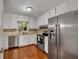Functional kitchen showcasing stainless steel appliances and white cabinets at 203 Concorde Sw Way, Lilburn, GA 30047