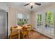 Inviting kitchen with dining nook and outdoor access through French doors at 203 Concorde Sw Way, Lilburn, GA 30047