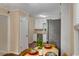 Compact kitchen with eat-in area, stainless steel appliances, and natural light at 203 Concorde Sw Way, Lilburn, GA 30047