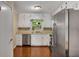 Charming kitchen with stainless steel appliances and bright window view at 203 Concorde Sw Way, Lilburn, GA 30047
