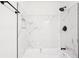 Modern bathroom features marble-like tile surround and matte black hardware at 250 Huntcliff Ct, Fayetteville, GA 30214