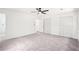 This airy bedroom offers plush carpeting, ceiling fan, and ample closet space at 250 Huntcliff Ct, Fayetteville, GA 30214