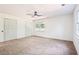 Bright bedroom features neutral walls, plush carpet, and generous closet space at 250 Huntcliff Ct, Fayetteville, GA 30214
