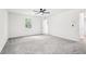 Large bedroom with neutral walls, ceiling fan, and plush carpet at 250 Huntcliff Ct, Fayetteville, GA 30214