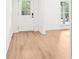 Bright entryway featuring hardwood floors and a view into the living area at 250 Huntcliff Ct, Fayetteville, GA 30214