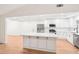 Modern kitchen boasts a large island, stainless appliances, and ample cabinet space at 250 Huntcliff Ct, Fayetteville, GA 30214