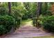 Backyard featuring steps leading to a lush yard and mature trees and shrubbery at 3115 Peachtree Ne Dr, Atlanta, GA 30305