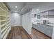 Basement laundry area with white cabinets, granite countertops, and modern washer and dryer at 3115 Peachtree Ne Dr, Atlanta, GA 30305