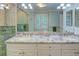 Bathroom with double sinks and granite countertops, walk-in shower and bright natural light at 3115 Peachtree Ne Dr, Atlanta, GA 30305
