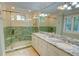 Elegant bathroom featuring a glass shower, double sinks, and granite countertops at 3115 Peachtree Ne Dr, Atlanta, GA 30305