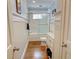 Bright bathroom featuring marble countertops, white wainscoting, and glass-enclosed shower at 3115 Peachtree Ne Dr, Atlanta, GA 30305