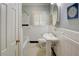Cozy bathroom features tiled floor, white fixtures, and natural light at 3115 Peachtree Ne Dr, Atlanta, GA 30305