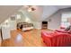 Charming bedroom with a decorative bed frame, hardwood floors, and comfortable seating area at 3115 Peachtree Ne Dr, Atlanta, GA 30305