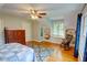 Bedroom featuring hardwood floors, built-in shelves and seat, and an accent rug at 3115 Peachtree Ne Dr, Atlanta, GA 30305