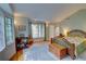 Spacious bedroom with hardwood floors, lots of windows, and ample natural light at 3115 Peachtree Ne Dr, Atlanta, GA 30305