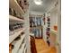 Well-organized walk-in closet with shelving and hanging space maximizes storage at 3115 Peachtree Ne Dr, Atlanta, GA 30305