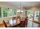 Inviting dining area featuring a classic wooden table and chairs, with access to an outdoor patio at 3115 Peachtree Ne Dr, Atlanta, GA 30305