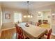 Elegant dining room has hardwood floors, shutters, and chandelier at 3115 Peachtree Ne Dr, Atlanta, GA 30305