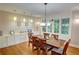 Elegant dining room with hardwood floors, ample natural light, and stylish pendant lighting at 3115 Peachtree Ne Dr, Atlanta, GA 30305