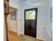 Elegant entryway with a paneled front door and hardwood floors, radiating classic charm at 3115 Peachtree Ne Dr, Atlanta, GA 30305