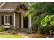 Inviting front porch with stone accents and lush landscaping create a welcoming entrance at 3115 Peachtree Ne Dr, Atlanta, GA 30305