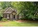 Charming home exterior featuring a well-manicured lawn, mature trees, and inviting curb appeal at 3115 Peachtree Ne Dr, Atlanta, GA 30305