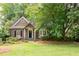 Charming home exterior featuring a well-manicured lawn, mature trees, and inviting curb appeal at 3115 Peachtree Ne Dr, Atlanta, GA 30305