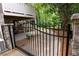 Gated driveway entrance with stone columns and lush greenery offering privacy and curb appeal at 3115 Peachtree Ne Dr, Atlanta, GA 30305