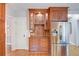 Charming kitchen featuring wooden cabinets, granite countertops, and stainless steel refrigerator at 3115 Peachtree Ne Dr, Atlanta, GA 30305
