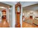 Spacious room featuring a classic grandfather clock, hardwood floors, and a view into the living room at 3115 Peachtree Ne Dr, Atlanta, GA 30305
